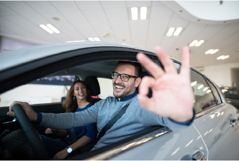happy-customer-buying-new-car-dealership