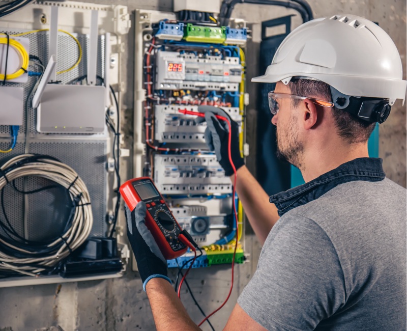 man-electrical-technician-working-switchboard-with-fuses